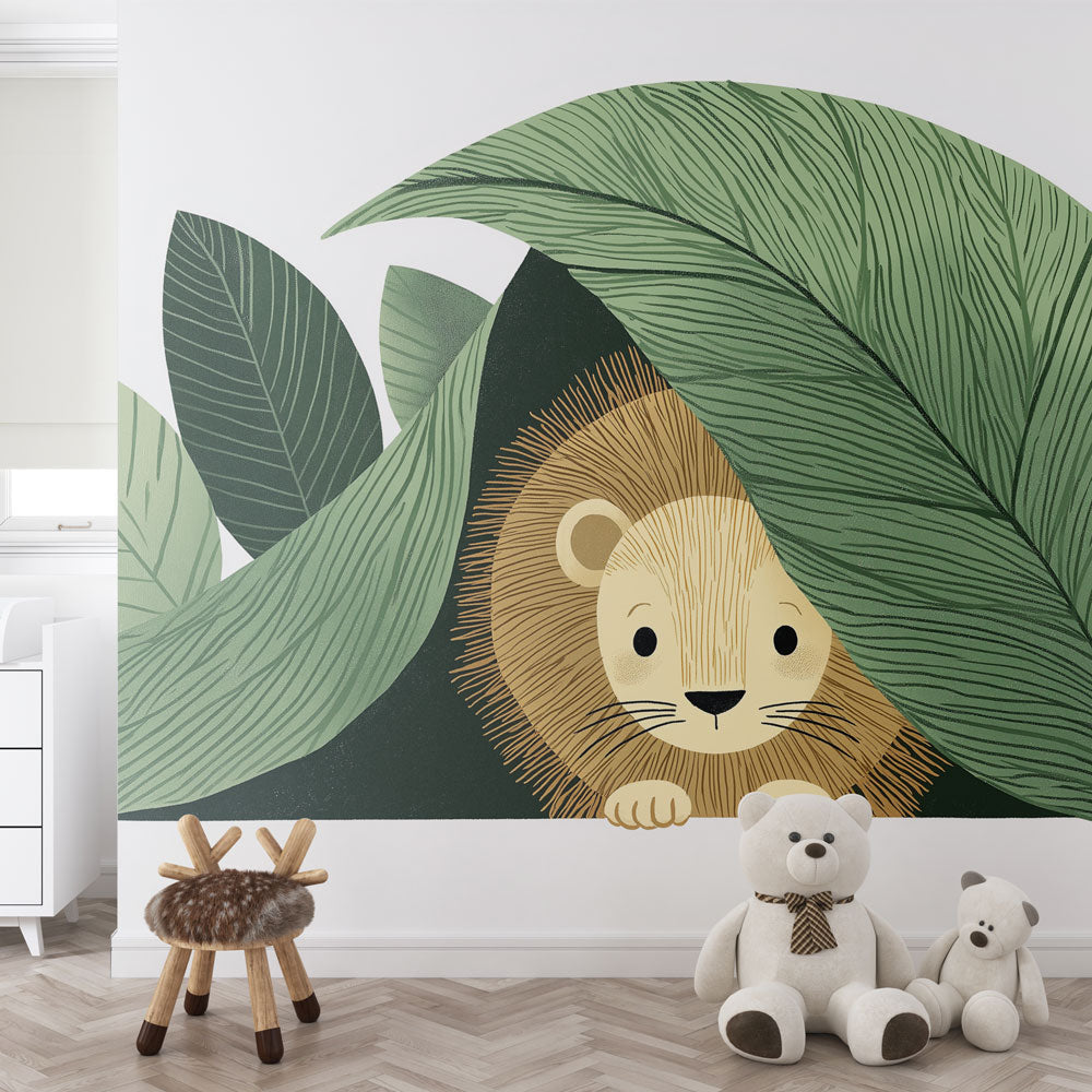 Lion Cub Wallpaper | Cub Peeking Behind Lush Leaves