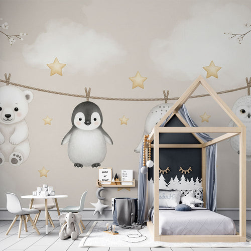 Bear cub, penguin, sea lion and owl wallpaper hanging under golden stars