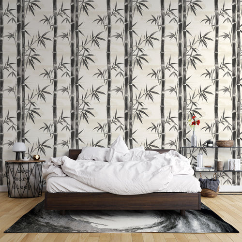 Bamboo stems wallpaper in black and white with delicate leaves on light background