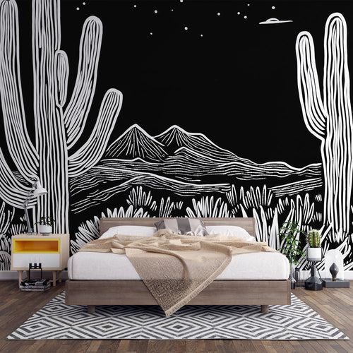 Black and white desert wallpaper with stylised cactus and mountain motifs