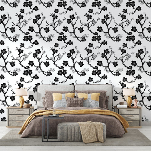 Black and white wallpaper with elegant flowering branches on a white ground