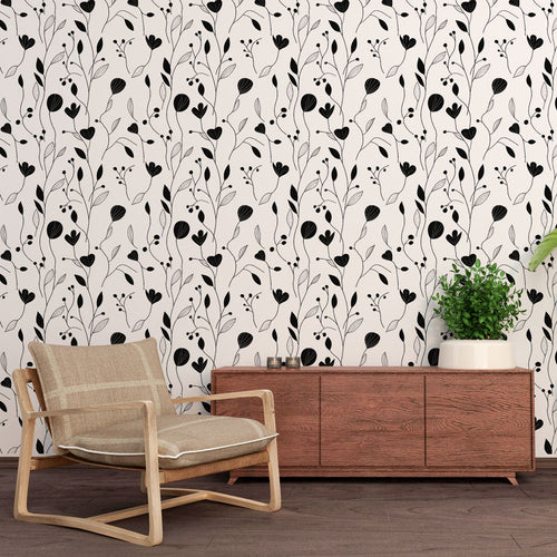 Black and white floral wallpaper with delicate flower and leaf drawings on pristine white ground