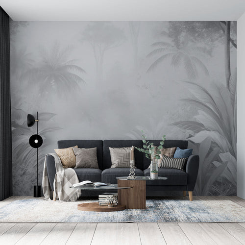 Black and white misty jungle wallpaper with palms shrouded in soft grey fog for industrial loft