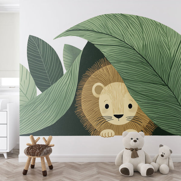 Lion Cub Wallpaper | Cub Peeking Behind Lush Leaves