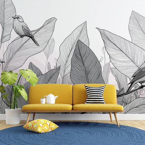 Black and white wallpaper with stylized birds perched on branches among large leaves