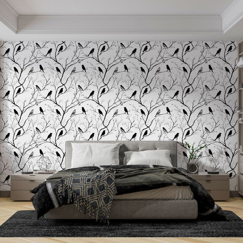 Black and white bird wallpaper with silhouetted birds perched on bare branches