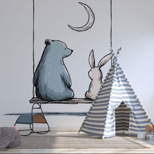 Wallpaper with blue bear and beige rabbit swinging under the moon