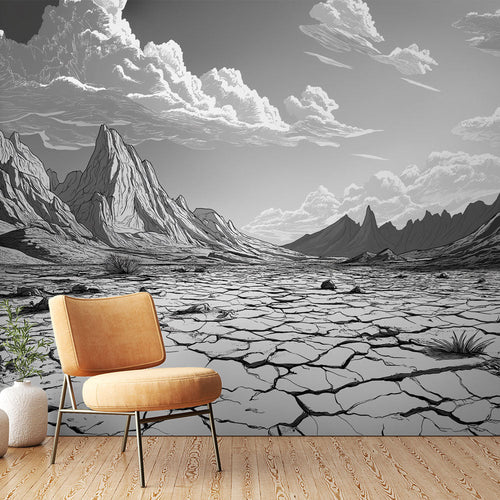 Black and white arid desert landscape wallpaper with mountains and cracked earth