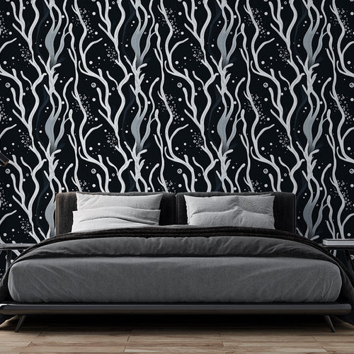 Black wallpaper with abstract white plant shapes in a contemporary living room