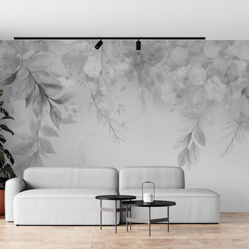 Black and white foliage wallpaper with falling watercolour leaves and elegant branches in poetic ink